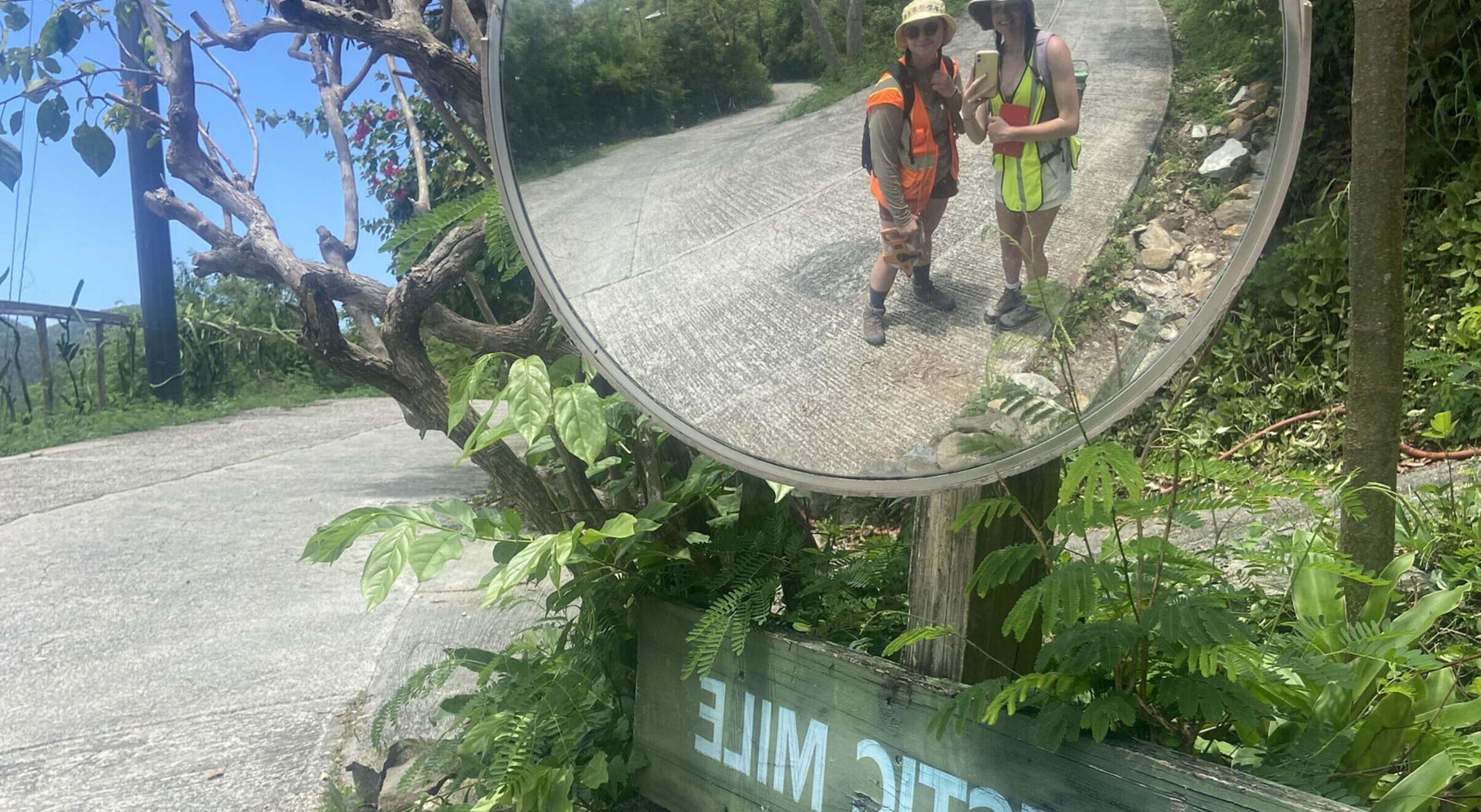 Students look into a mirror overlooking the Majestic Mile in St. John US Virgin Island.